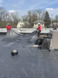 Cleveland Heights commercial roofing company performing flat roof replacement on business property